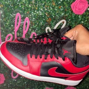 Black and red Jordan 1 low